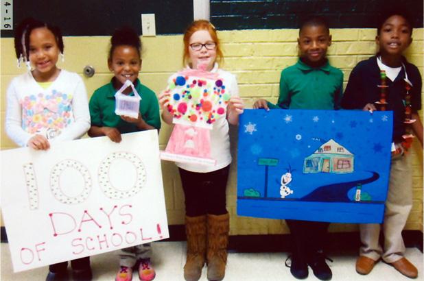 100th day of school celebration Winners were, pictured (l-r ): First place, Erkijah Davis with her shirt of 100 buttons; second place, Zion Collins with a house made with 100 Q-tips; third place, Isabella Lax with a bank with 100 gum balls. Honorable mention, Brandon Bufford with drawing with 100 snowflake; honorable mention, Akevious Haddix with a necklace made with 100 gummy savers.