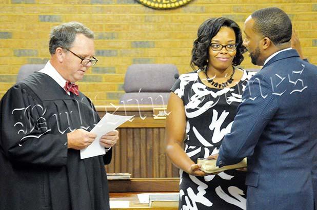 Bolivar Mayor McTizic takes the oath of office from Hardeman County General Sessions Judge Boyette Denton as wife Demetria looks on. Photo by Hannah Pattat.
