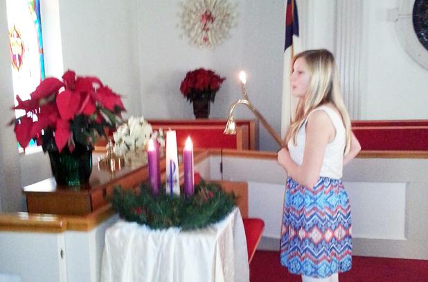 Ruthie Harstin lit the Advent candles at the Middleton United Methodist Church Chrismon Tree service. 
