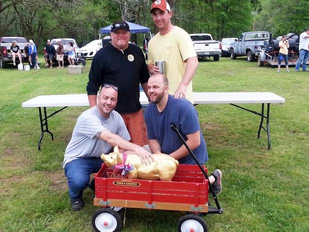 Grand Junction’s Getting Piggy in the Park winners Winner of the Battle of the Cities and claiming the Golden Pig for the second year in a row was team “Inhognito” (l to r) kneeling: Ian Marshall and Jacob Fox; standing, Mike Rice and Matt Hixson.