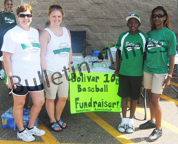 Players on the the 9-10 year old All Stars and their parents held a bake sale on Saturday, June 20, at the Bolivar Wal Mart. Photo (l-r) Sarah Rice, Brittney Clark, Trey Turner, Octavia Patterson.