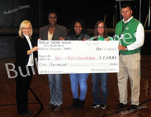 BMS makes Donation to Make a Wish Bolivar Middle School Principle Mary Ann Polk presents a Check for $1,000 to Laura Moore of Make a Wish. Photo (l-r): Laura Moore, Volunteer Wish Granter for Make a Wish; Mary Ann Polk, Principal; Ashanti Joy, Guidance Counselor; Kristy Sims, Instructional Facilitator; Brian Mays, Assistant Principal.