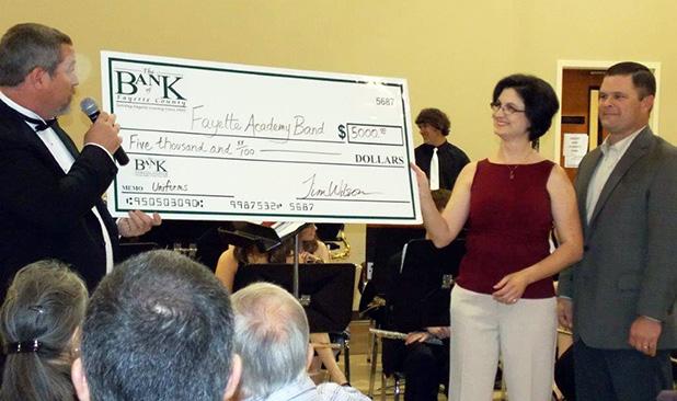 Fayette Academy Band receives donation Fayette Academy Band receives donation for new uniforms
