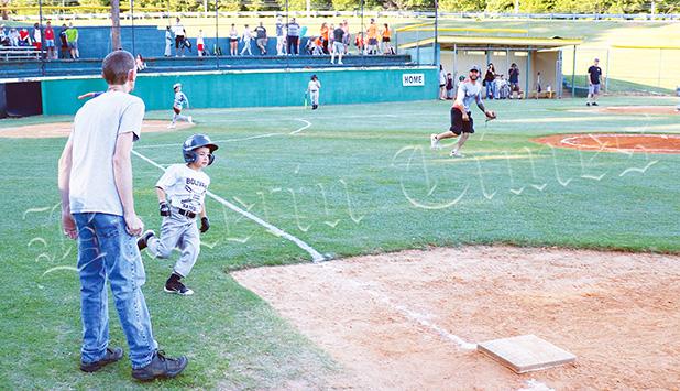 The Gray (6U) team’s Landon Taddy legs out an extra base hit in his teams 8-1 loss on June 11. Baseball Gets Late Start, But Starts