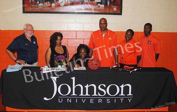 MHS's Whatley signs with Johnson University Pictured (l-r): Clay Young (Assistant Coach Johnson University) Amanda Ayers (mother) Antonia Whatley, James Burkley (Middleton head coach), Treka Tate (Middleton assistant coach, Monterio Williams (Middleton assistant coach).