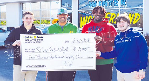 Dameon Nowelin, Managing Partner at Bolivar Ford, Bolivar Central Head Football Coach Woodrow Lowe, and Bolivar Central players Jaylan Beard and Matt Jackson. 