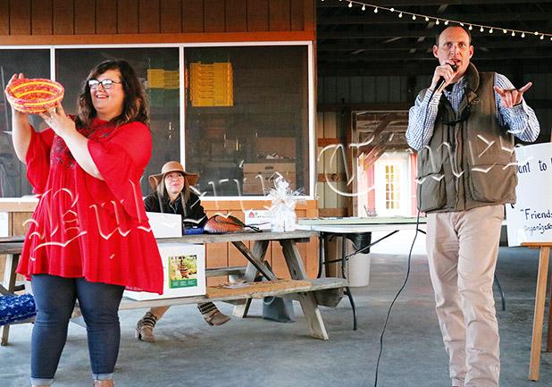 Library Raises Funds at Falcon Ridge Hutchinson with Jody Jackson of Lynn Jackson Auctions and Real Estate. Jackson conducted the live auction free of charge. Photo by Ginger Tester.