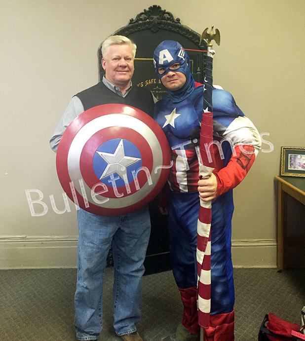 Allen Mullins, AKA Captain America, visits with Hardeman County Mayor Jimmy Sain during his stopover in Bolivar last week on his way to Chattanooga, from Seattle Wash., to hep raise money for veterans. 