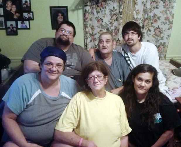 Caregivers need care too The Henrys pose for a family portrait one week before the father’s death from cancer. Front (l-r) daughter Tiffany Rustin, mother, Glenda, and daughter Robin Pittman. Rear,(l-r) son James, Jr., father, James Henry, and son Robert. The family provided around-the- clock care for their father as he progressed through his terminal illness. “We were emotionally and physically exhausted”, said Rustin.