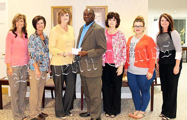 Giving Back to the Communities Julie Strope, Sharon Cossar, Tara Barnes, Monroe Woods, Cathy Mayfield, Bailee Hutchinson, and Holly Thurmond.