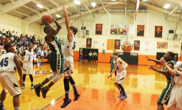 Bolivar boys take middle school championship Bolivar’s D. J. Smith goes up for a shot against St. Mary’s in the Area Regional Tournament finals on Friday, January 30.