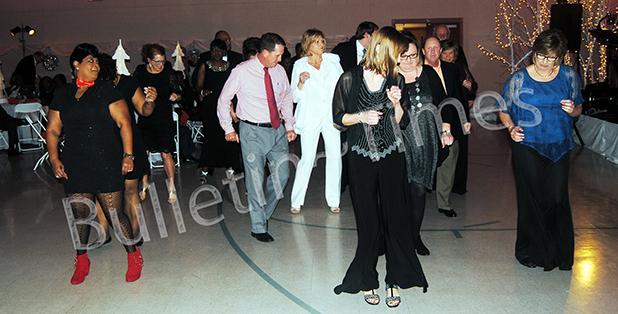 Snowflake Ball celebrates 10 years Attendees of the 2016 Snowflake Ball enjoy dancing to the music of Magi.