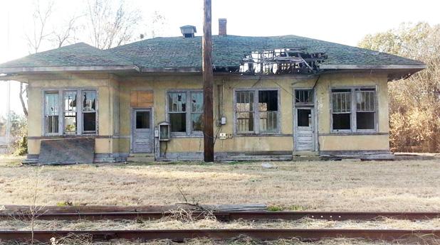 The Grand Junction railroad depot is shown as it appeared one month ago. Approximately one third of the roof had rotted and fallen through. The floor beneath this hole had rotted away as well. The Grand Junction Depot Museum Corporation, under the leadership of Kathy Ledbetter, has raised enough money to begin restoration and a contract has been awarded for completion of  phase one.