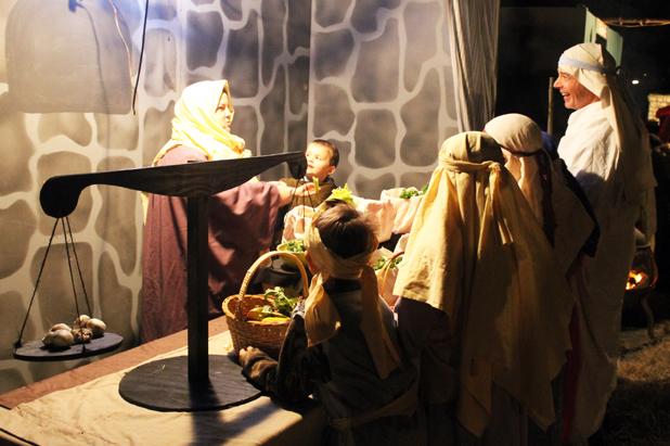 Living Nativity tells the story of Christmas The market scene during the “Living Nativity” reflected individuals in period costumes purchasing food items, linens, candles and other goods.