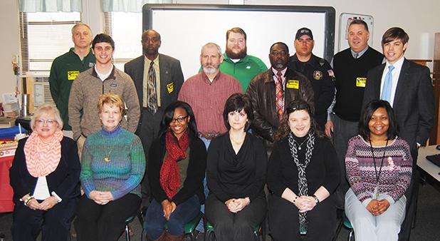 Volunteers for Read Across America at Bolivar Middle School pictured front row (l-r): Carla Clifft, Helen Henning, Kyelin Walker, Cathy Mayfield, Amelia Monroe Carlson, Ashanta Joy Back row (l-r): Rick Rudesill, Kaleb McKinnie, Fredell Harris, Terry Richardson, Chris Moore, Charles Gatlin, Tommy Breeden, Warner Ross Jr., Blake Sain.