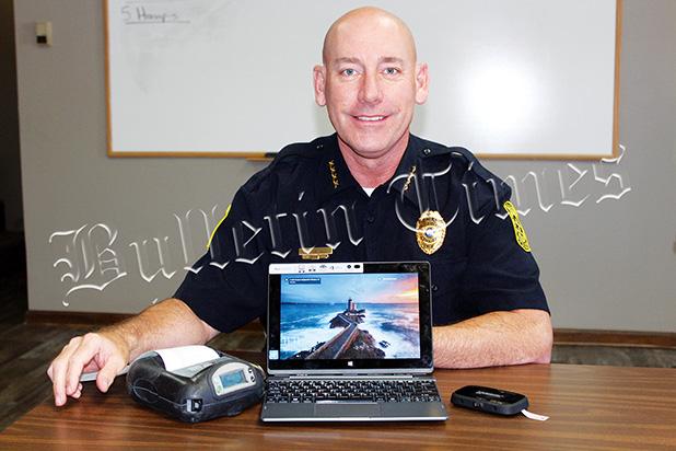 Bolivar Police Chief Pat Baker with the new E-ticket computer system. The machine on the left prints your ticket, while the computer  serves as a functional take away tablet that an offender also uses to sign their ticket, with the smaller box has portable wi-fi capabilities for any need that may arise.