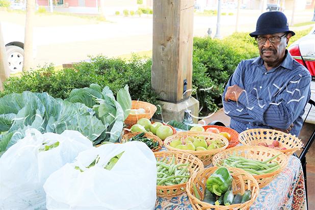 Lester Cox at his stall at the Bolivar Farmers Market by Ginger Tester