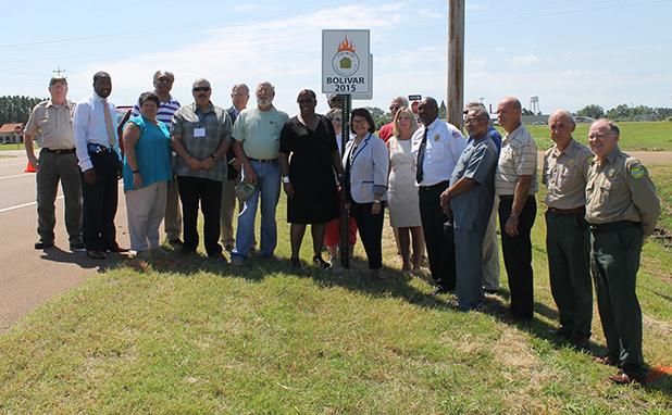 Bolivar becomes a Firewise Community Bolivar Fire Chief Lynn Price was joined by State Senator Dolores Gresham, Bolivar Mayor Barrett Stevens, Bolivar City Administrator Shelia Dellinger, city council representatives, members of the Firewise Committee as the city received its Firewise recognition. Photo by Sarah Rice