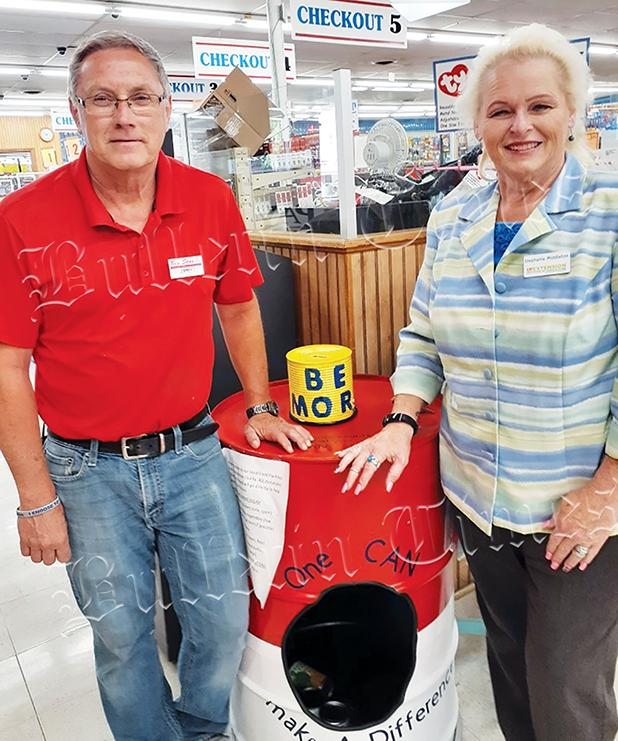 Jimmy Howell, assistant manager of Bolivar’s Food Giant, and Stephanie Middleton recently set up a bin for food donations near the front of the store.