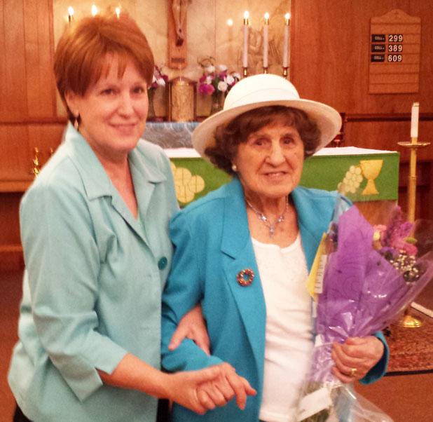 Francys Garrett, pictured with her daughter Patricia Qualls (left), was presented with flowers and serenaded with “Happy Birthday” by those at St. Mary’s Catholic Church in Bolivar on her birthday.