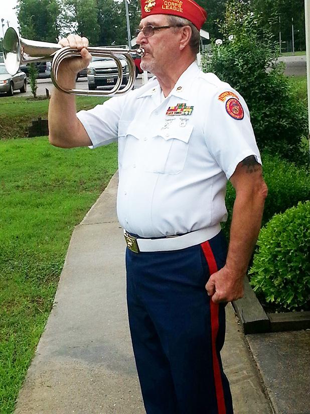 Gerald Nichols of the Marine Corps League played Taps after members of American Legion Post 198 had placed the memorial wreath honoring Middleton’s war dead.
