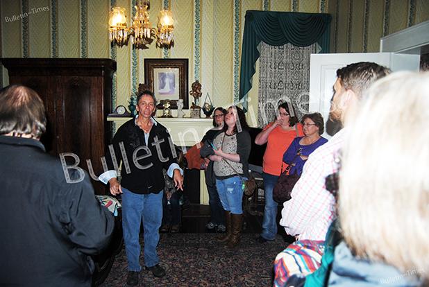 Magnolia Manor ends ghost tours Gregg Rivers (center) conducts one of the last ghost tours at Magnolia Manor.