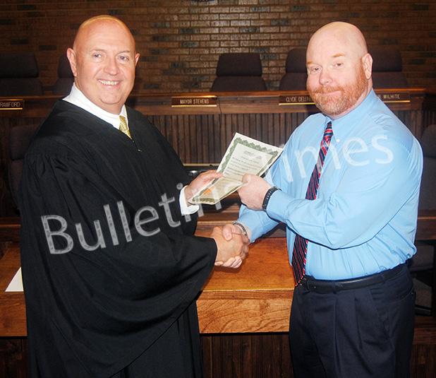 Bolivar City Council Members take oath Bolivar City Judge Steve Hornsby congratulates Councilman Todd Lowe.