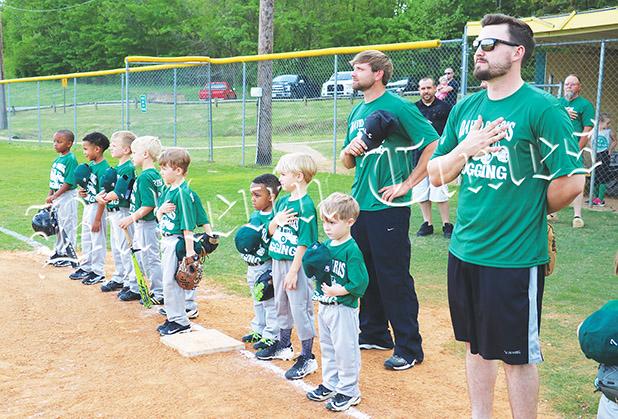 David Dorris Logging honors America during the National Anthem. They beat ProtecStor 5-4 in the opening night for the 6U division.