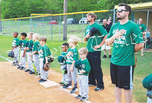 Baseball Season Starts in Bolivar David Dorris Logging honors America during the National Anthem. They beat ProtecStor 5-4 in the opening night for the 6U division.
