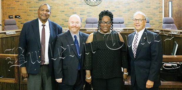 Raises Yes, Tax Increase No Sworn-in on July 1 were (from left to right) incumbent councilmen Larry McKinnie and Todd Lowe, along with newly-elected councilpeople Carol B. Spinks and Larry Crawford. Photo by Johnny Weems.