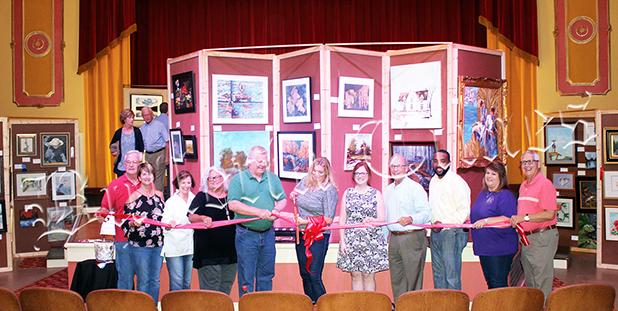 Forest Festival Chairperson Tina Garrison cuts the ribbon to open the 2018 Tennessee Forest Festival in the Luez Theatre, which is hosting the Forest Festival Art Show and Contest.  Photo by Erica Garrison