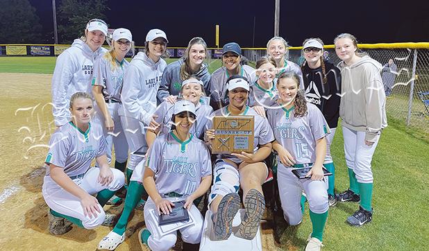 Senior Brooklyn Jimmerson poses with the second place plaque and her teammates. Jimmerson (who was injured on Monday night during Ripley game) is doubtful for the first round of the region, but could be available if the Lady Tigers advance.