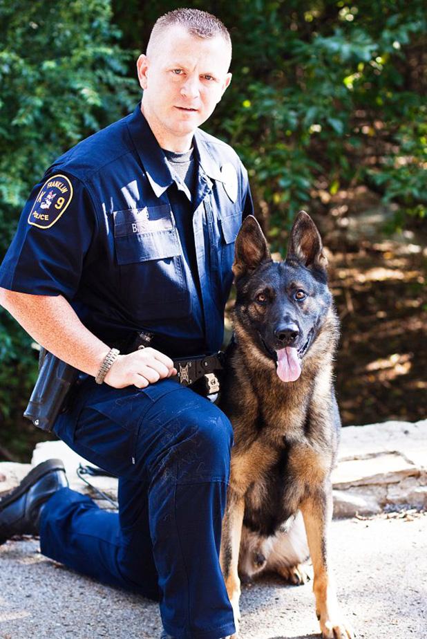Pictured is Nashville Metro Officer Terry Burnett with his K-9 Aron, who the new legislation is named after.