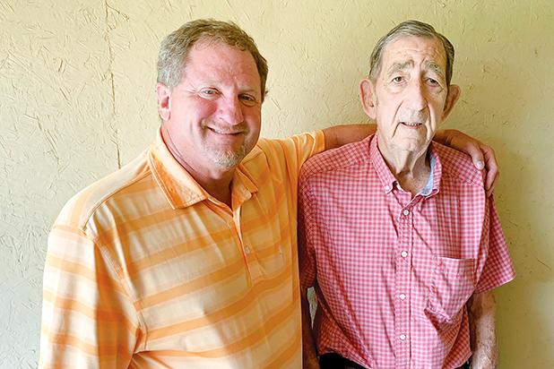 Scholarship to Honor County Teacher Established Chuck Latham (left), president and CEO of Chuck Latham Associates Inc., is pictured with his high school agriculture teacher, Huey Mott, for whom he has named a scholarship at the University of Tennessee at Martin.