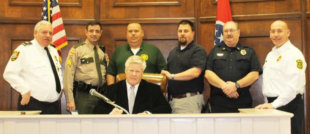 Pictured front, Hardeman County Mayor Jimmy Sain. Back row (l-r) Middleton Police Chief Lynn Webb, Tennessee State Highway Patrol Sgt. Don Velez, Hardeman County Sheriff John Doolen, Hornsby Police Chief Shane Swift, Toone Police Chief Jerry Siler and Bolivar Police Chief Pat Baker.