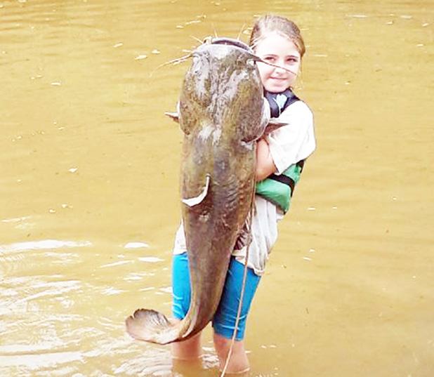 Lydia Sain caught her 40 pound yellow catfish on the Fourth of July. She is the daughter of Junior and Candice Sain.