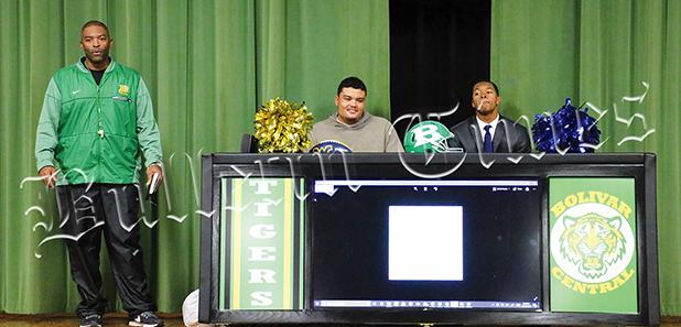 Mays (left), and Lowe (right), with Bolivar Central Head Coach Woodrow Lowe, were honored in a ceremony, which included them receiving their high school diplomas on December 11. Both signed the official paperwork at home. 