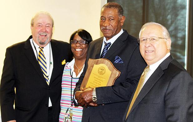 McGowan named Employee of the Year Western Mental Health Institute’s James Earl McGowan has been named 2014 Department of Mental Health and Substance Abuse Employee of the Year. James McGowan (third from left) is pictured with Western Mental Health CEO Roger Pursley (left), McGowan’s supervisor, and Assistant Commissioner of Hospital Services John Arredondo.
