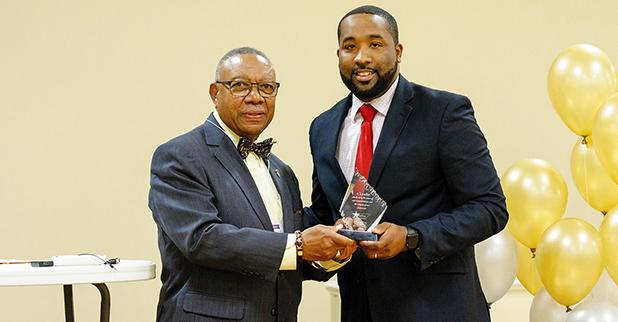 McTizic (right) is pictured accepting the African American Conference Emerging Leader Award from Evelyn Robertson Jr., WestStar class of 1997.