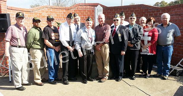 Shown are the veterans and participants in the American Legion Post 198 Veterans Day Ceremony at the Veterans Wall in Middleton. Mayor Jackie Cox, guest speaker, told the gathering it was a great honor to stand in front of the wall honoring those who served. 