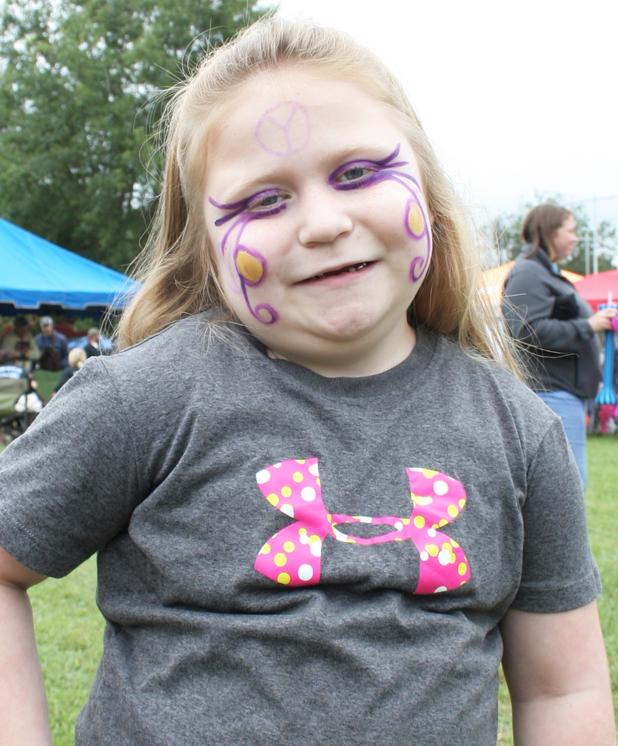 Morgan Bizzell, 6, strikes a pose after getting her face painted.