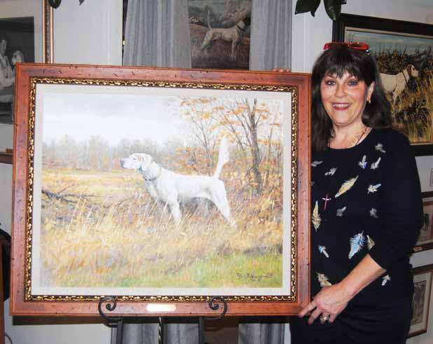 National Field Trial Championship begins at Ames Plantation Tanya Brotherton, Executive Director of the Bird Dog Foundation Inc. unveils a painting of the 2014 Field Dog Champion, Shadow Oak Bo.