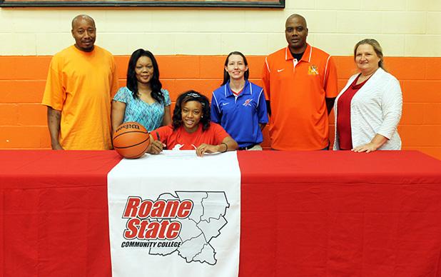 Rachelle Parks signed with Roane State to play basketball on the college level. Pictured are (l-r) Philip Parks (father), Stacey Parks (mother), Rachelle Parks (seated), Monica Bowles (Roane State head coach), James Burkley (MHS Lady Tigers head coach), Darlene Cardwell (MHS Principal).