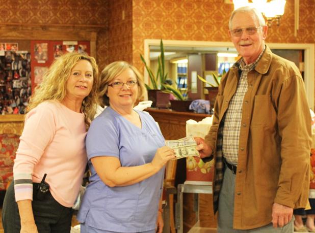 Loaves and Fishes receive donations Pine Meadows donated canned food items and non-perishables to Loaves and Fishes, along with $250, as a result of their annual Thanksgiving food drive with families of their residents. Pictured (l-r) Sharon McKeen (Director of Marketing and Admissions), Connie Pritchard (Director of Nursing) and Ken ‘Bo’ Lain (Loaves and Fishes administrator)