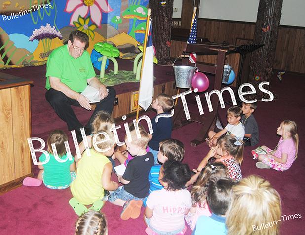 Porters Creek Baptist Church hosts VBS Porters Creek pastor, Rev. Adrian Knipper relays a Bible story to a group of children during VBS on Monday, June 15.