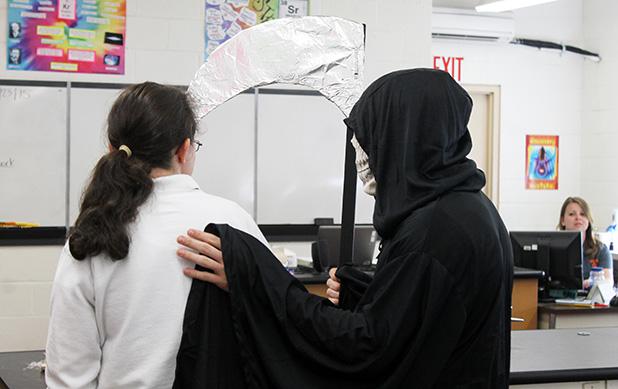 ‘Every 15 minutes’ Every 15 minutes the Grim Reaper took another student at Middleton High School to show the reality of alcohol related deaths. Pictured is the Grim Reaper taking Sarah Hooper out of class as her obituary will be read to the class by Middleton Police Chief Lynn Webb.