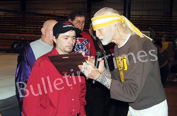 Ripley, Miss benefit features legends and local wrestlers CWA promoter Rodney “Mega Man”Grimes is presented a plaque by “Handsome” Jimmy Valiant inducting Grime's mother, Rosa Lee Grimes Abrell, into the CWA Hall of Fame during a benefit for her on Friday, March 11 in Ripley, MS.