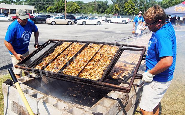 Rotary Chicken Day a tradition in Hardeman County For more than 35 years, members of the Bolivar Rotary club have braved the heat of the summer to stand over a hot Bar B Q pit cooking chicken halves to help raise money for various events in the community, and year after year they sell out. About 1,000 chicken halves were sold this year, and about $6,000 was raised. Rotary members Frank Wilhite and Chris Bell begin the process of flipping about 500 chicken halves.