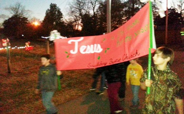 Youth from the Saulsbury Baptist Church marched in the Annual Christmas Parade under the banner “Jesus is the Reason for the Season”.   