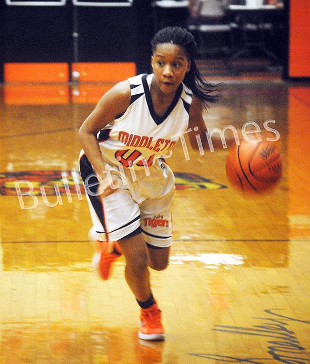 Middleton ladies continue winning streak Shalexus Smith handles the ball for Middleton.